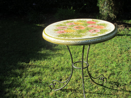 Tavolo in ceramica tondo con disegno di anemone e base in ferro